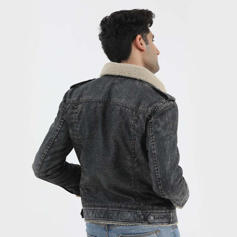 Rugged Elegance: Denim Jacket Adorned with Stylish Leather Patches